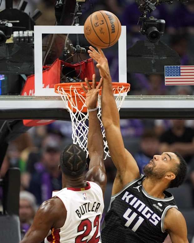 Oct 29, 2022; Sacramento, California, USA; Sacramento Kings forward Trey Lyles (41) blocks a shot by Miami Heat forward Jimmy Butler (22) during the third quarter at Golden 1 Center. Mandatory Credit: Darren Yamashita-USA TODAY Sports